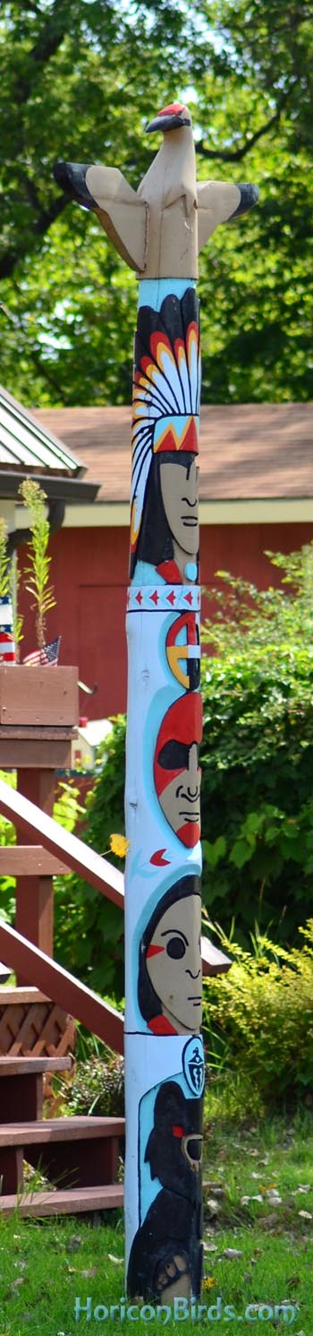 Whooping crane tops a totem pole on Menominee reservation, Wisconsin, photo by Pam Rotella